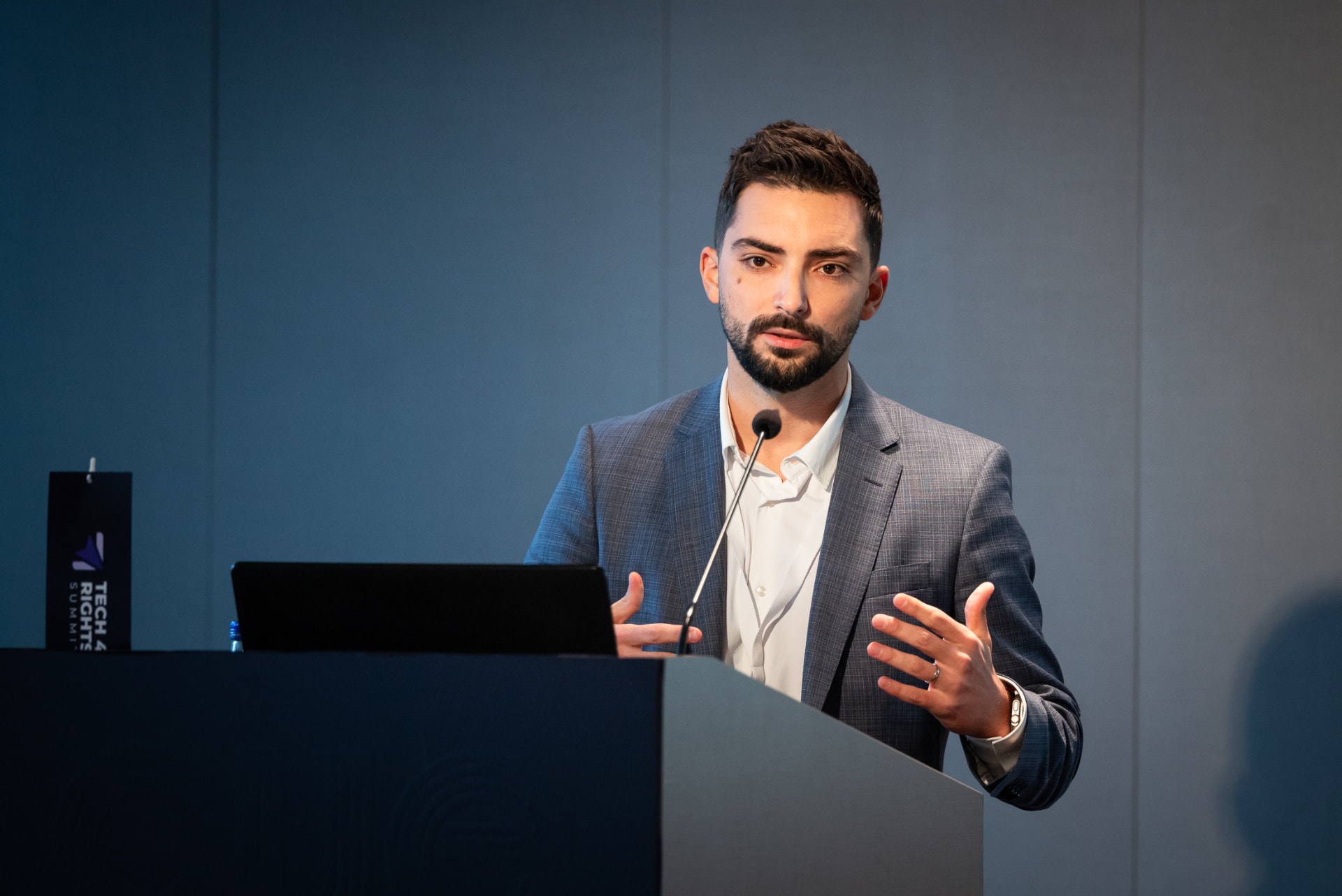 Branko Džakula speaking at a lectern at the Tech & Rights Summit.
